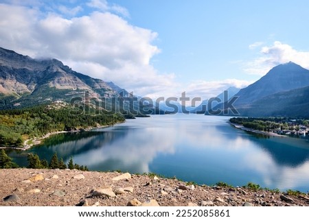 A steep climb up the Bear's Hump trail leads to awesome views of a calm and peaceful Waterton Lake.  Alberta, Canada Royalty-Free Stock Photo #2252085861