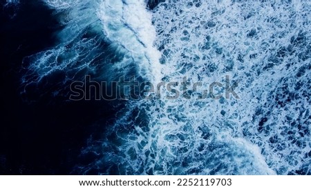 Top view dark blue sea water wave Big wave in black sea Top-down form aerial view Drone high quality camera. Royalty-Free Stock Photo #2252119703