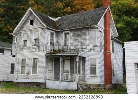An abandoned and rundown white house near Watkin Glens, Upstate New York Royalty-Free Stock Photo #2252128893