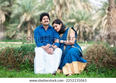 beautiful south indian girl resting her head in his husband greenfield
