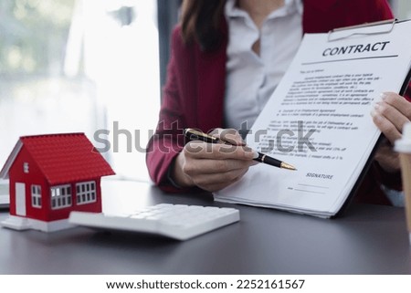 Business woman doing real estate sale, installment payment and mortgage loan concept. 