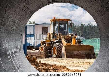 Powerful crawler bulldozer close-up at the construction site. Construction equipment for moving large volumes of soil. Modern construction machine. Road building machine Royalty-Free Stock Photo #2252163281