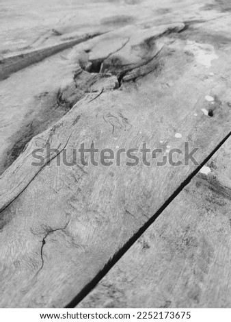 This black and white picture is a close up of a wooden bed which is very common in India. This photo will make a great background for articles that take reader down the memory lane.