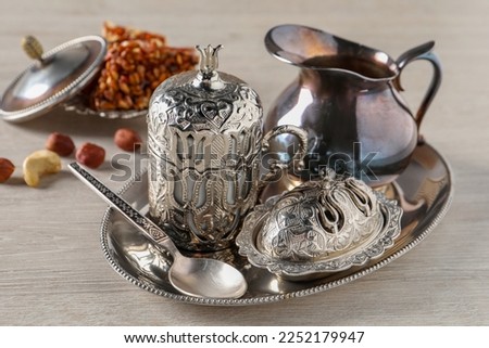 Tea and Turkish delight served in vintage tea set on wooden table