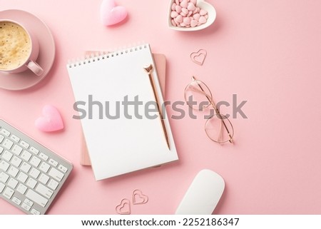 Valentine's Day concept. Top view photo of notepad pen glasses keyboard computer mouse heart shaped candles clips saucer with sprinkles cup of coffee on isolated pastel pink background with copyspace