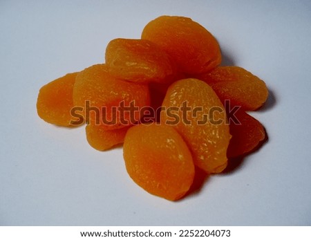 Dried apricot isolated. is an oval-shaped drupe which has the scientific name Prunus armeniaca. This fruit has a mixed taste of sweet and sour.