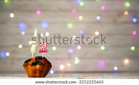 Happy birthday background with muffin and number of candles on light bulbs bokeh background. Greeting card happy birthday copy space with number 72