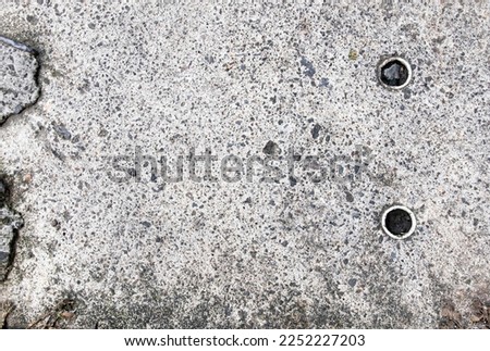 Dirty white concrete wall with black stains texture