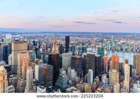 New York City skyline with urban skyscrapers at sunset.