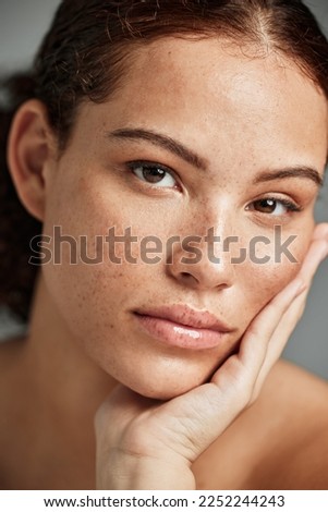 Portrait, beauty skincare and face of woman in studio isolated on gray background. Makeup, natural cosmetics and young female model with glowing, healthy and flawless skin after spa facial treatment.