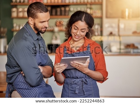 Restaurant, cafe teamwork and couple with tablet to manage orders, inventory and stock check. Diversity, waiter technology and man and woman with digital touchscreen for managing sales in coffee shop Royalty-Free Stock Photo #2252244863