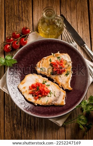 grilled swordfish with diced tomatoes Royalty-Free Stock Photo #2252247169