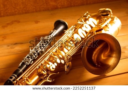 Classic music Sax tenor saxophone and clarinet in vintage wood background Royalty-Free Stock Photo #2252251137