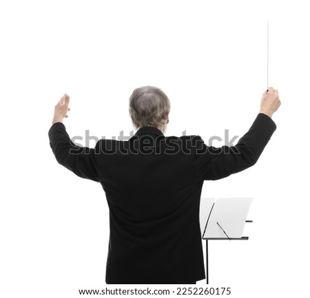 Professional conductor with baton and note stand on white background, back view Royalty-Free Stock Photo #2252260175