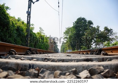 Picture of a rail anchor on a railway track of Indian Railways system.