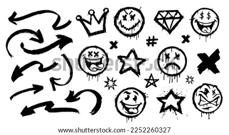 Vector graffiti spray patterns set such us smiles, arrows, crown, stars on a white background.