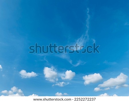 Small clusters of white cumulus clouds are scattered across the sky beautiful at Trang, Thailand. no focus Royalty-Free Stock Photo #2252272237