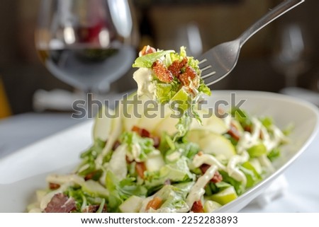 Caesar salad with a bit of bacon, restaurant salad. Italian salad. green salad Royalty-Free Stock Photo #2252283893