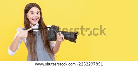 advertisement. photographer beginner with modern camera. Child photographer with camera, horizontal poster, banner with copy space. Royalty-Free Stock Photo #2252297851