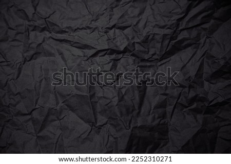 Black crumpled craft paper background.  Black history month concept. Copy space
