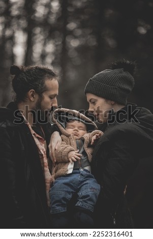New born family photo shoot in the fall by the woods
