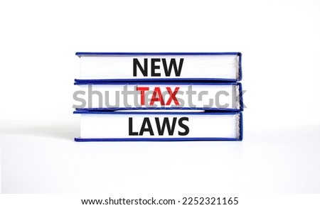 New tax laws symbol. Concept words New tax laws on books on a beautiful white table white background. Business new tax laws concept. Copy space.