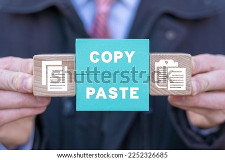 Concept of copy and paste computer files. Operations of electronic documents or archive: COPY or PASTE. Perfect copy-paste. Plagiarism. Royalty-Free Stock Photo #2252326685