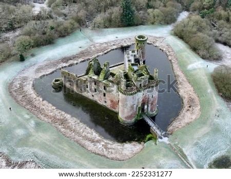 Caerlaverock Castle is a moated triangular castle first built in the 13th century. It is located on the southern coast of Scotland Royalty-Free Stock Photo #2252331277