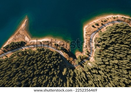 Aerial view of road on coast by lake