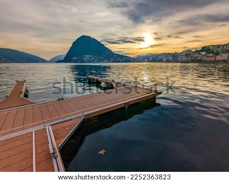 Lugano, Switzerland. Amazing aerial view of the Swiss city, surrounded by lake and mountains.