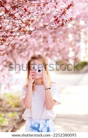 young beautiful girl, hipster, , taking pictures, photographer,vintage camera,
