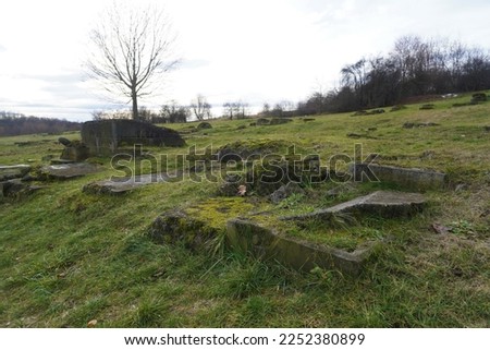 Destroyed graves in an abandoned Jewish cemetery in Krakow. Photo was taken in Poland, in krakow, near the Liban quarry and Kraków-Płaszów concentration camp.