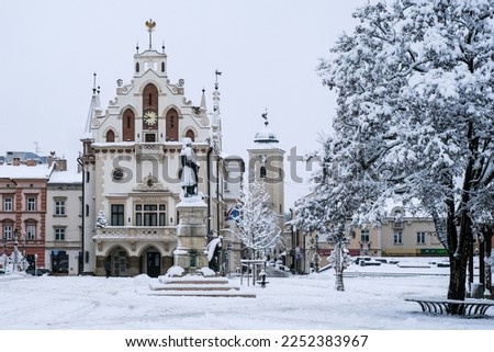 The town hall (Ratusz Rzeszow) in the main square, or old market square (Rynek miejski w Rzeszowie), of Rzeszow, Poland, in snow. Royalty-Free Stock Photo #2252383967