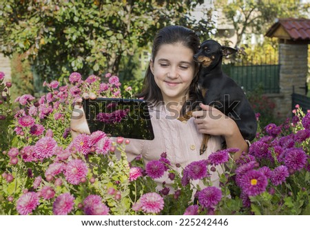 Child shooting flowers with tablet