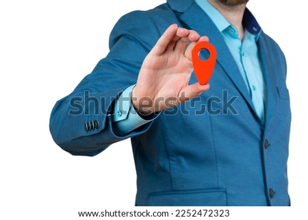 Businessman holding a red location pin pointer