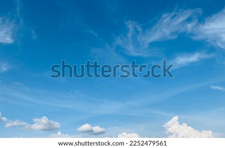 Small clusters of white cumulus clouds are scattered across the sky beautiful at Trang, Thailand. no focus Royalty-Free Stock Photo #2252479561