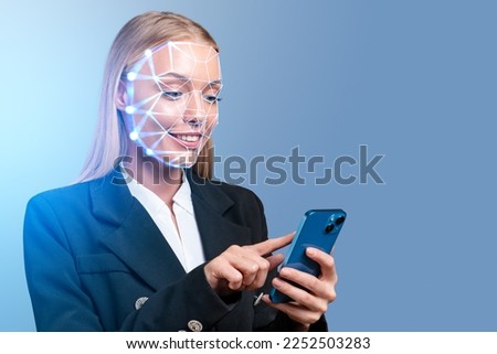 Smiling businesswoman finger touch phone, biometric verification and facial recognition. Concept of face id and artificial intelligence Royalty-Free Stock Photo #2252503283