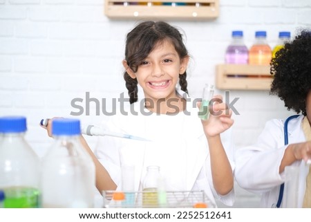 Children doing chemical experiments in school laboratories, science students, experiment, observation and curiosity concept. The first step of becoming a scientist