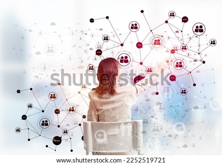 HR specialist managing abstract social network structure. Back view long haired woman in white suit sitting on white chair. Recruitment and resourcing. Global company human resources management.