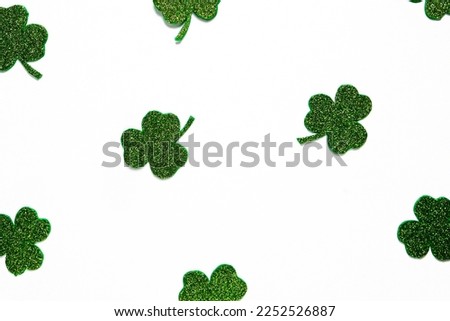 Happy St. Patrick's Day banner.Holiday background.St Patricks Day frame against a white background. Flat lay shamrocks.Copy space.Patrik's day banner Royalty-Free Stock Photo #2252526887