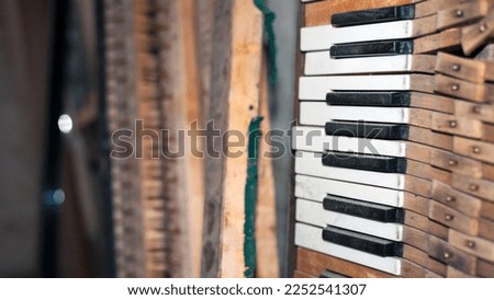 keys. black and white keys of an old piano. details of a musical instrument. close-up. disassembled, broken keyboard instrument, piano or grand piano, wood parts