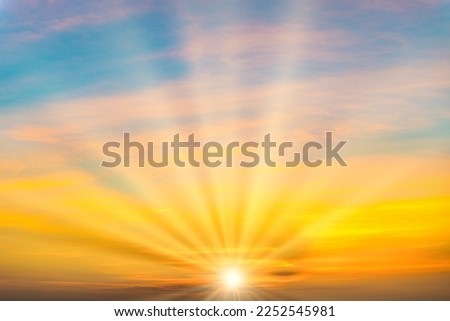 Sky with sunset colorful clouds and sunrays on sunset sky Royalty-Free Stock Photo #2252545981