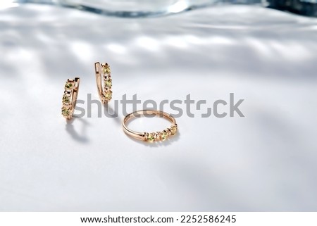 Elegant jewelry set. Jewellery set with gemstones. Jewelry accessories collage. Product still life concept. Ring, necklace and earrings. Royalty-Free Stock Photo #2252586245