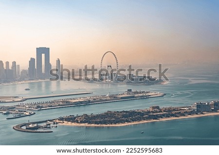 Amazing view of the Ain Dubai in the evening. the city of murom in the fog. top view of the dubai marina shore. view at the palm Royalty-Free Stock Photo #2252595683