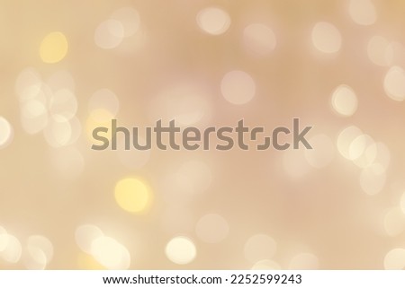 Abstract bokeh background beige colored, natural flare from lights, beige monochromatic photo with optical effect, blurred round bokeh texture as holiday backdrop, celebration wallpaper, neutral color