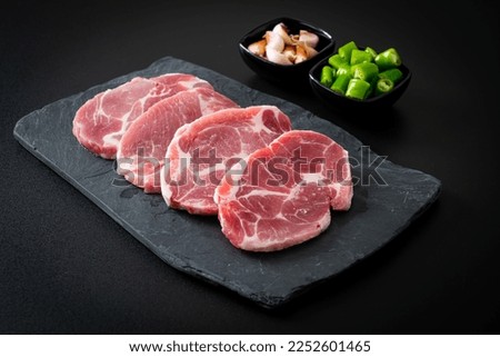 fresh pork neck raw or collar pork on board with ingredients for marinated Royalty-Free Stock Photo #2252601465