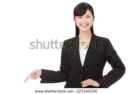 Japanese businesswoman pointing down