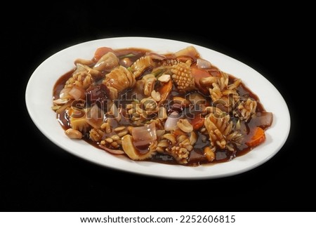 Squid (calamari ) Kung pao sauce,  Chinese and Japanese cuisine pictures, isolated on Black background.
