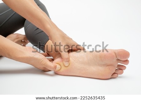 Plantar fasciitis treatment for foot pain Royalty-Free Stock Photo #2252635435