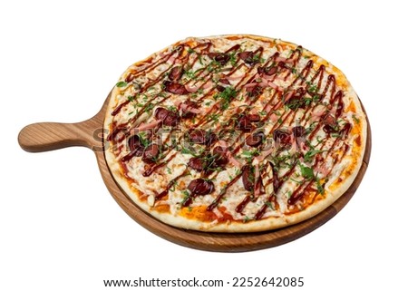 Barbecue pizza with sausages and ham served on a wooden board. Appetizing traditional Italian food. Close-up. Isolated on a white background. Top view.